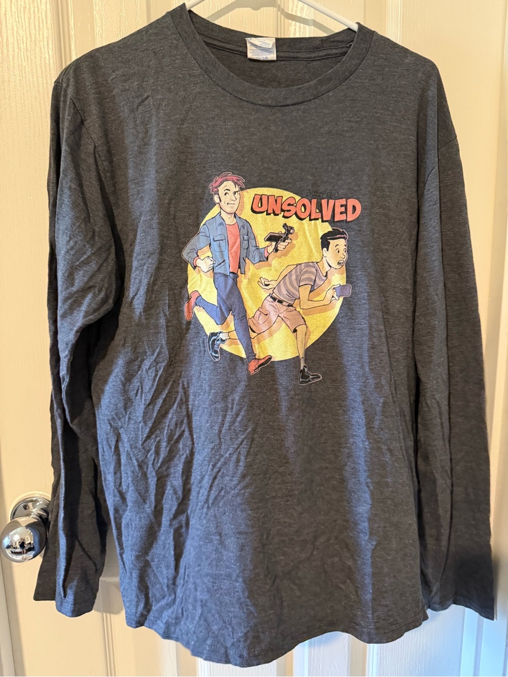 Port and Company Charcoal Gray Long Sleeve Tee with 'Unsolved' Graphic
